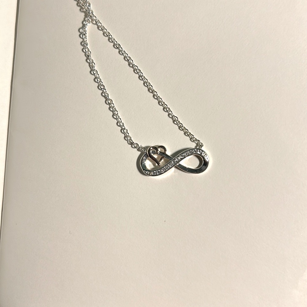 Sterling silver 16' extender eternity symbol with a dozen diamonds